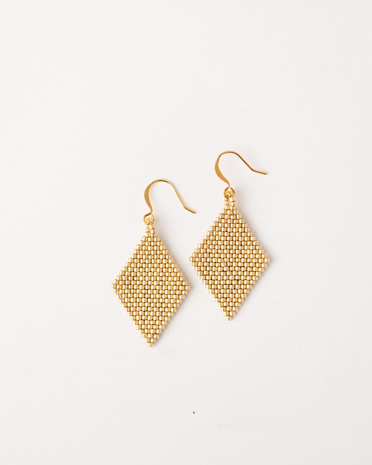 gold diamond shaped beaded earrings. 2" drop on ear wire.