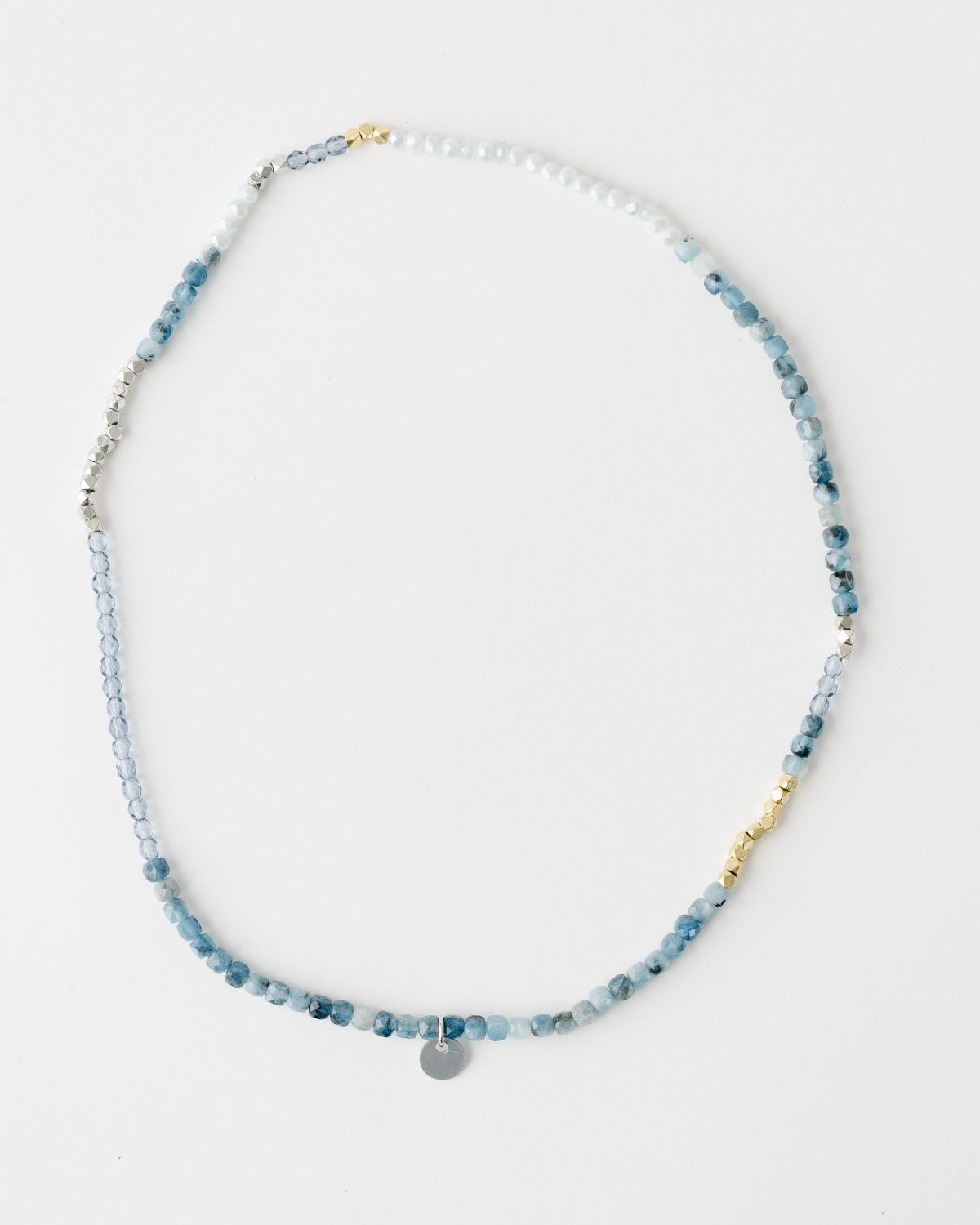 20" beaded necklace on stretch cord that can also be worn as a wrap bracelet. Blue, white, gold, and silver