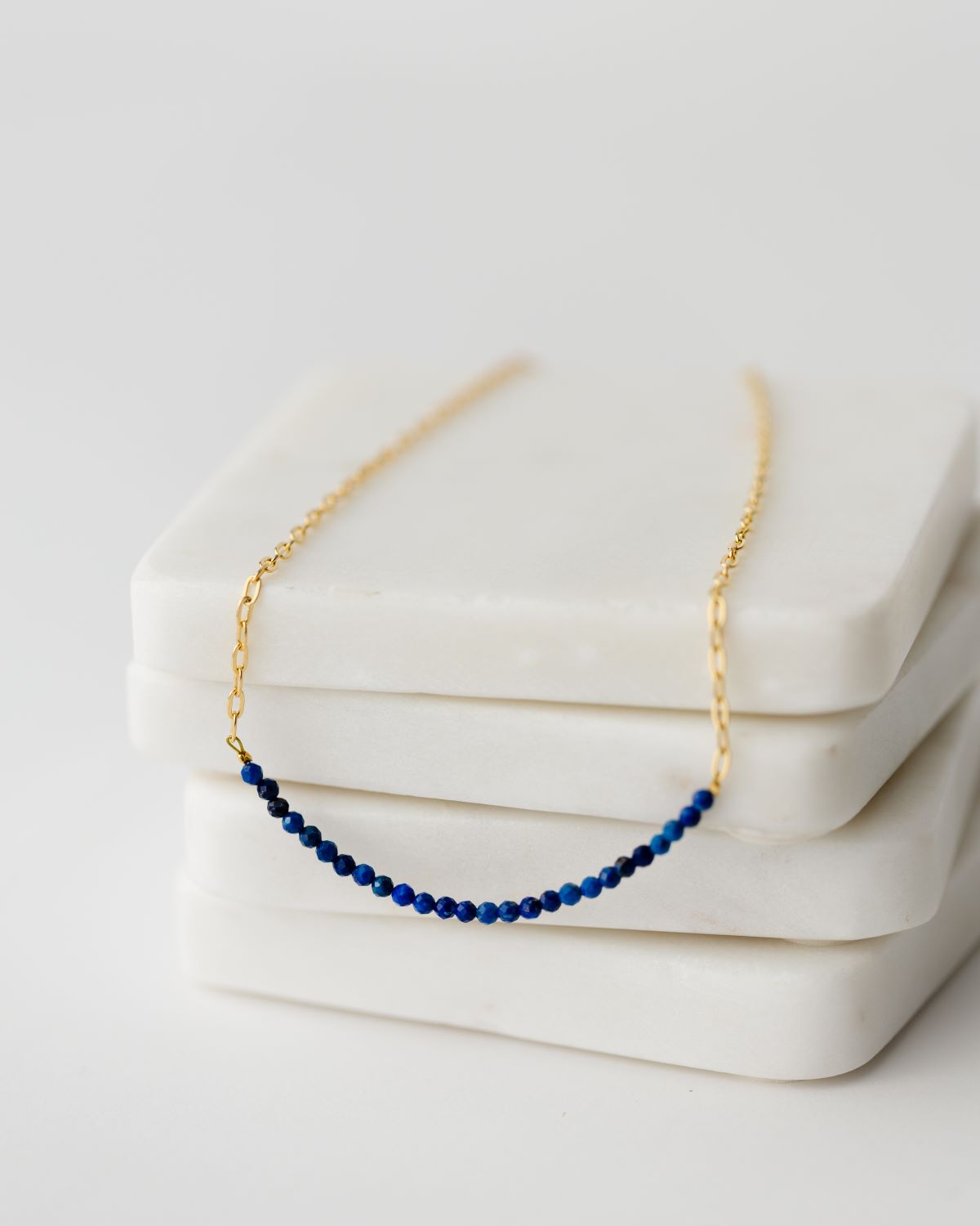delicate gold 16 inch paperclip chain with large row of Lapis Lazuli stones