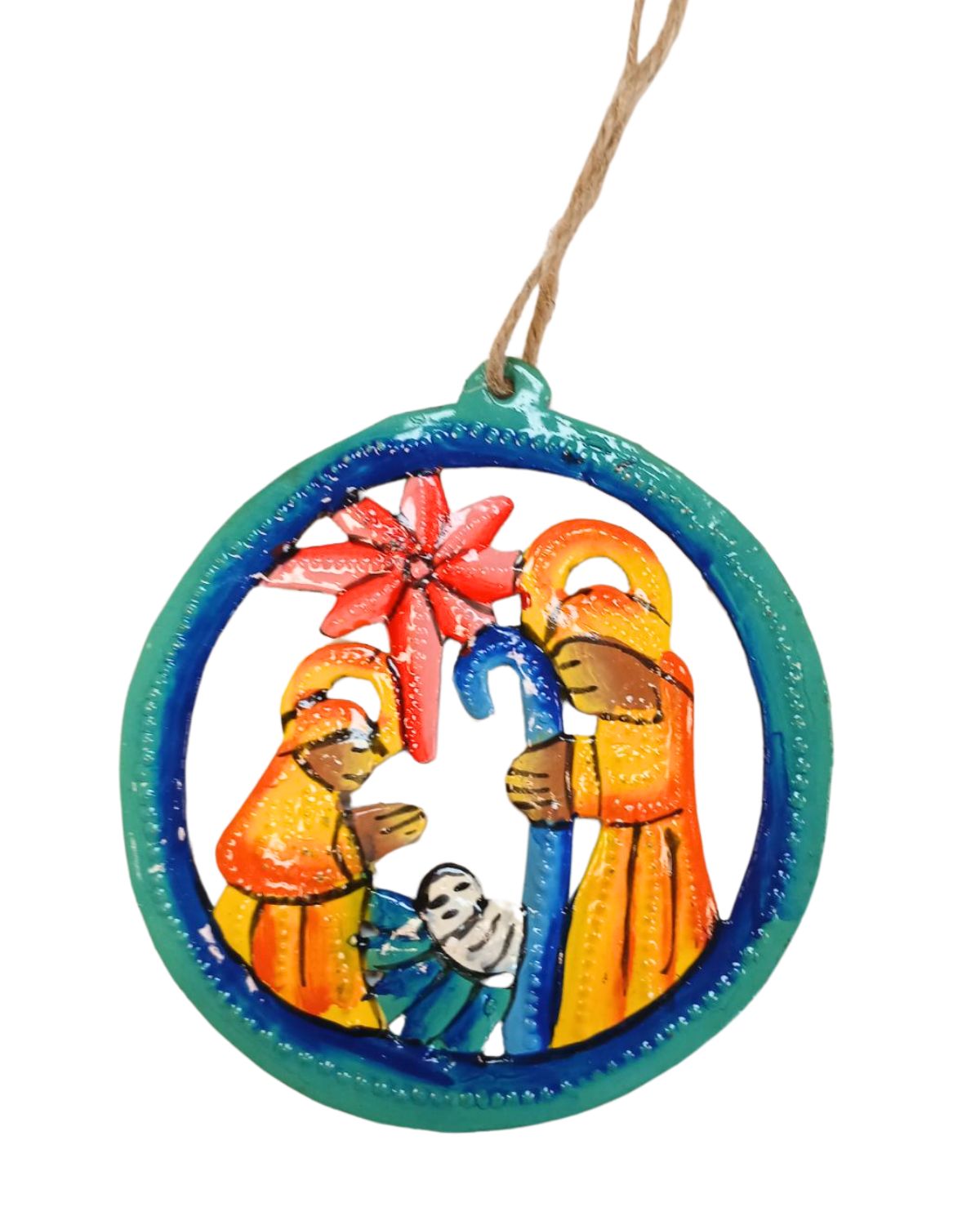 A round, painted nativity ornament featuring colorful figures of the nativity scene on a green background with a brown hanging ribbon.