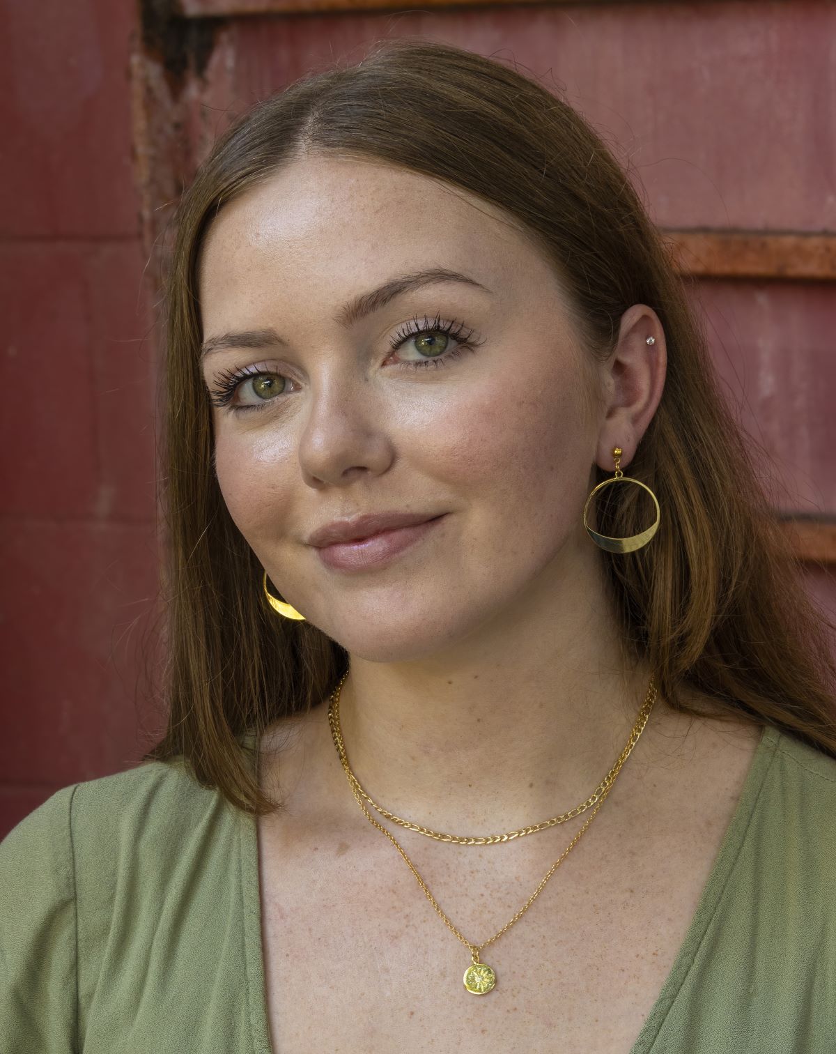 small gold hoop earrings on gold stud