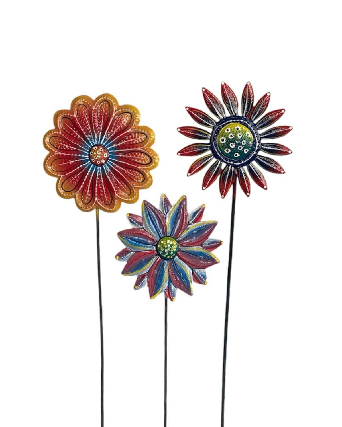 Three colorful flower-shaped garden stakes on a white background