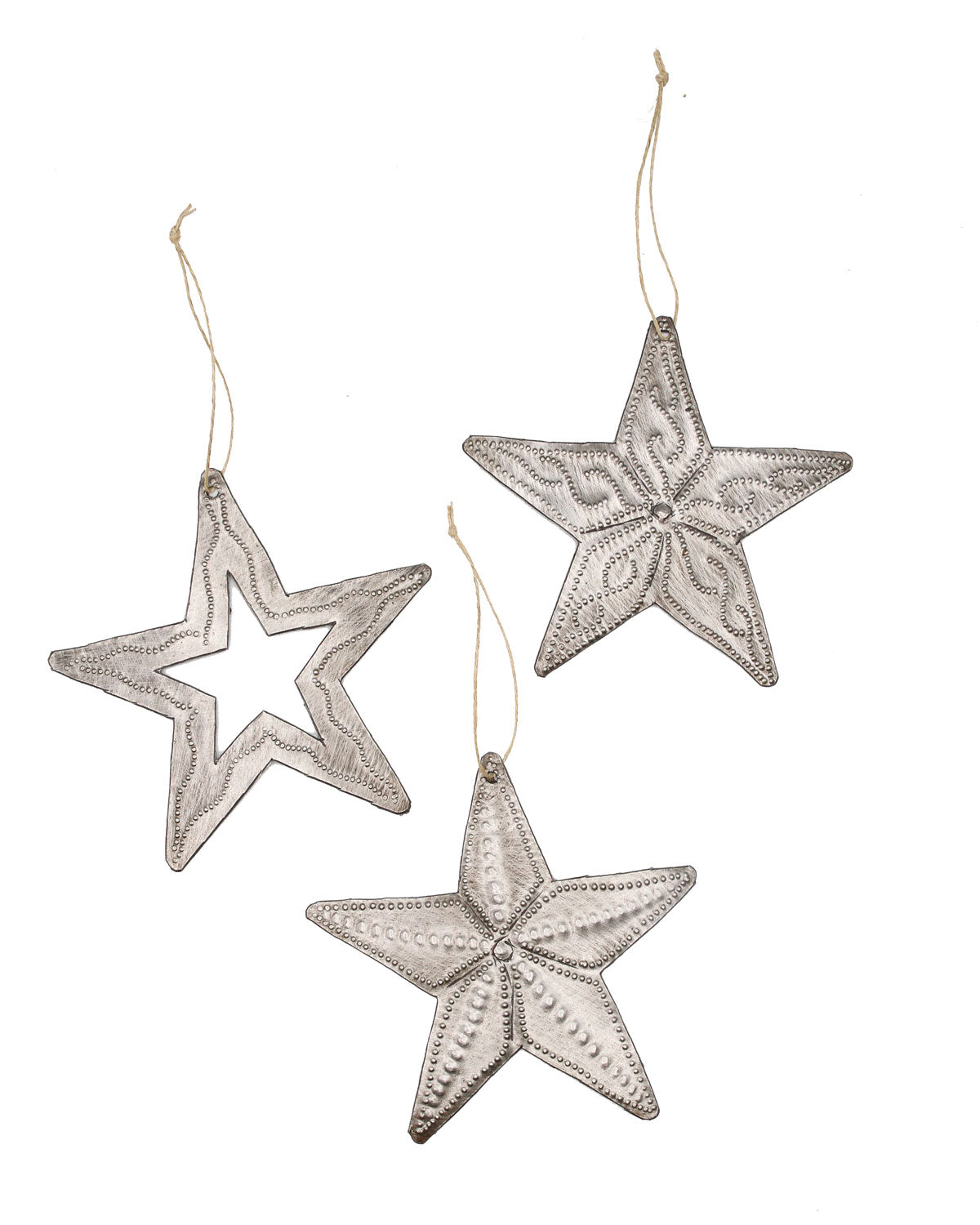 A set of three metallic star ornaments with intricate cut-out patterns, suspended by strings.