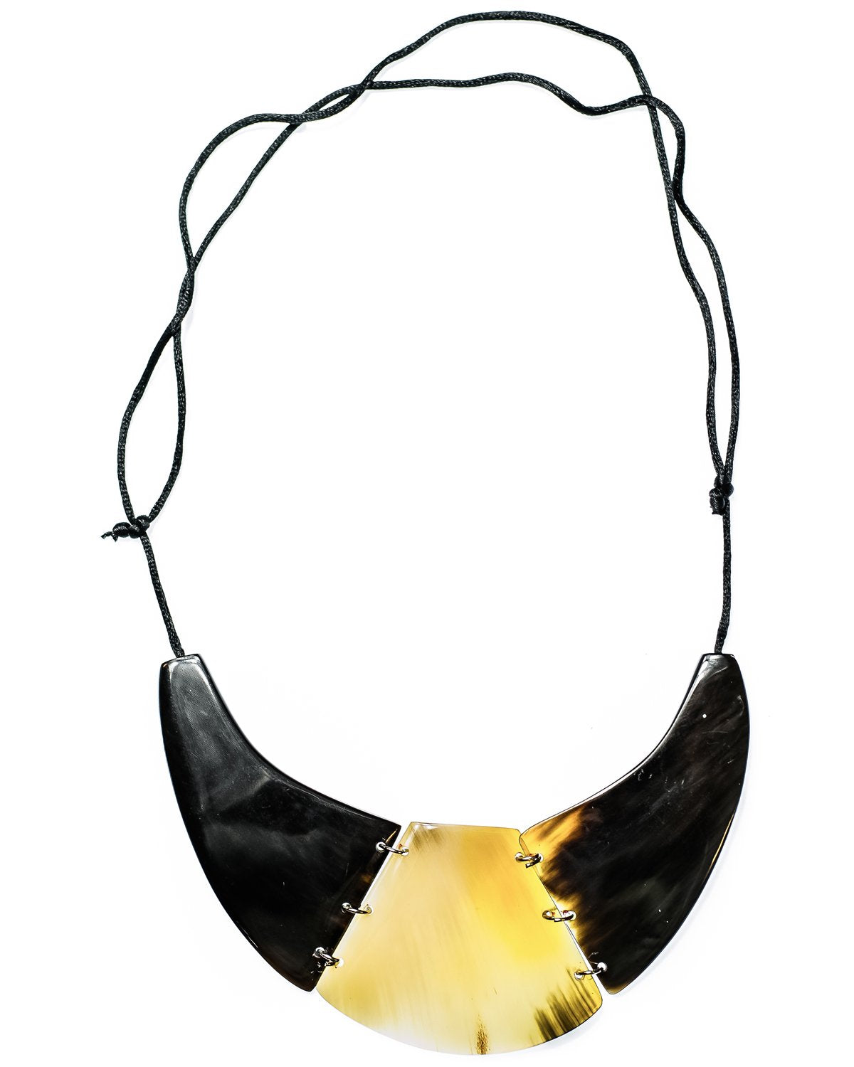 A handcrafted cow horn necklace with an adjustable cord, featuring varying shades of browns, black, grays, and ivory.