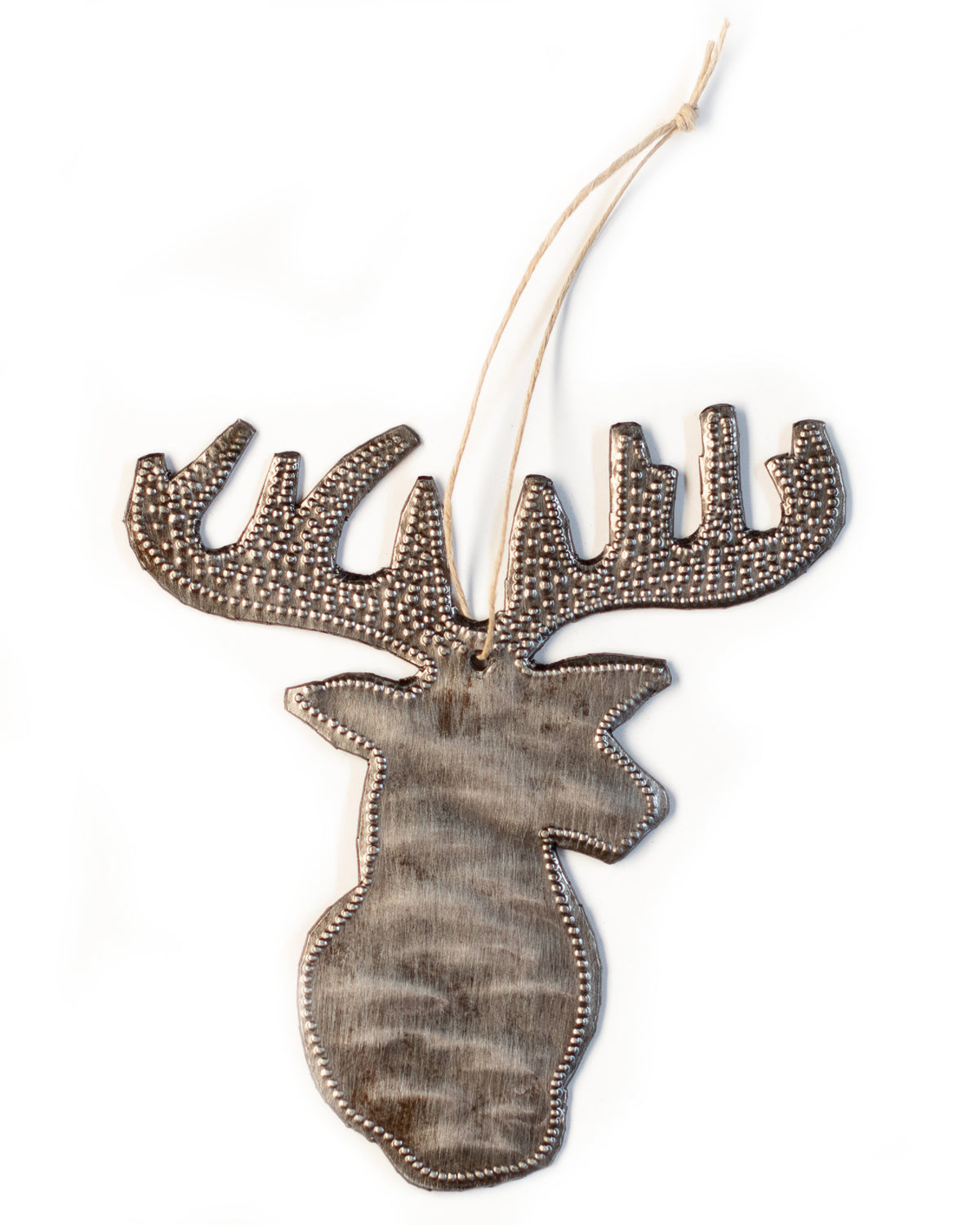 A handmade metal deer head ornament with a textured surface and a beaded antler.