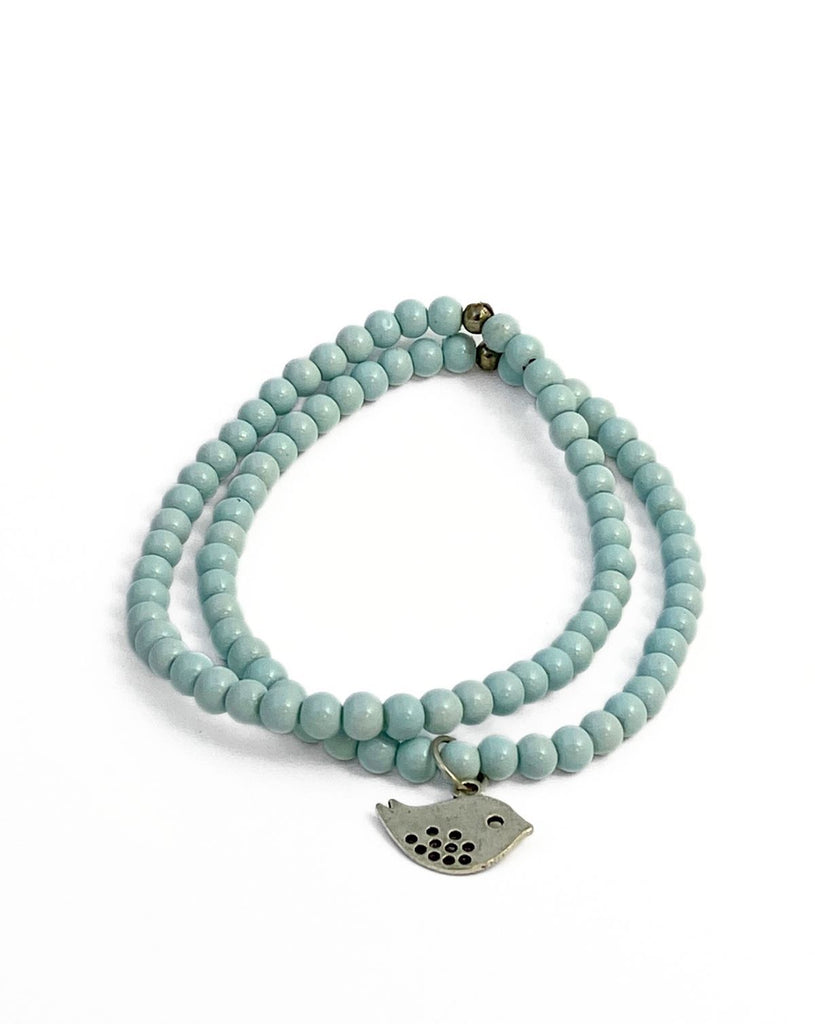 two sky blue beaded stretchy bracelets with one silver bird charm