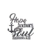 Galvanized metal wall decor featuring the phrase 'Hope anchors the soul Hebrews 6:19' with an anchor illustration, shown on a plain white background.