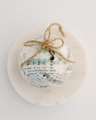 ball ornament made with recycled hymnal paper