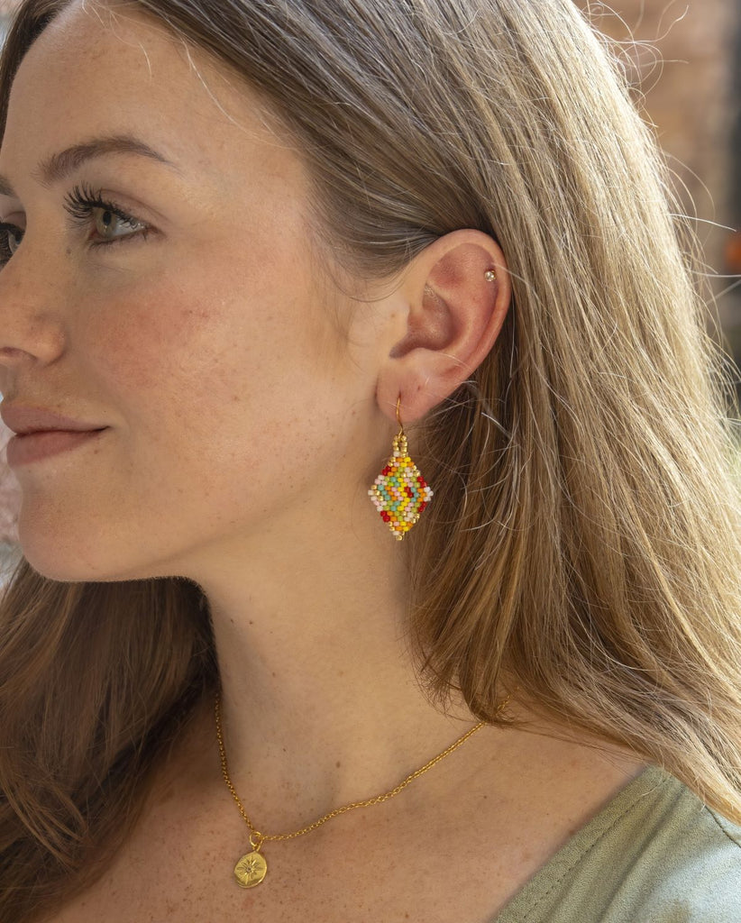 Beaded multicolor diamond shaped earrings large on model