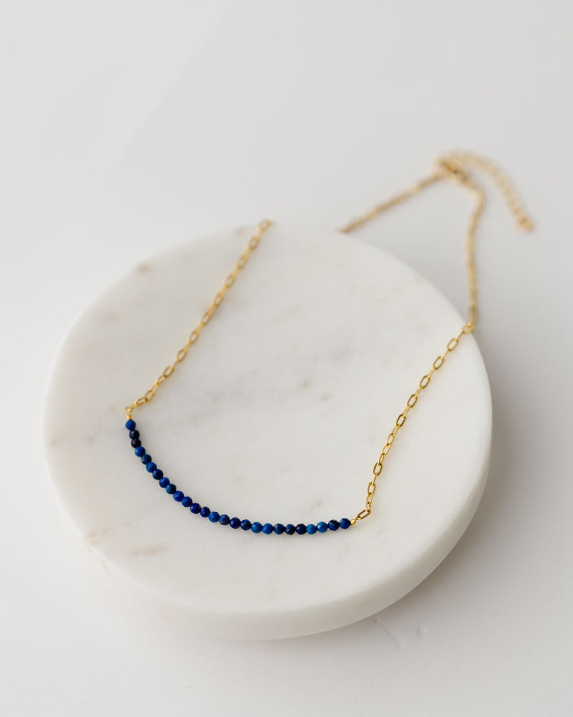 delicate gold 16 inch paperclip chain with large row of Lapis Lazuli stones