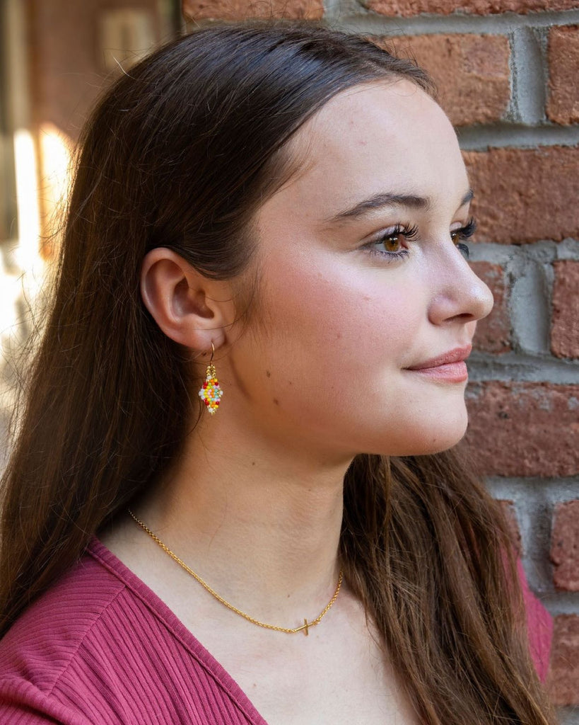 small multicolor beaded earrings on model