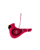 Red bird-shaped ornament on a white background