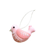 Pink bird-shaped ornament on a white background