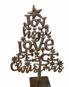 Decorative Christmas tree topper with motivational phrases on a white background