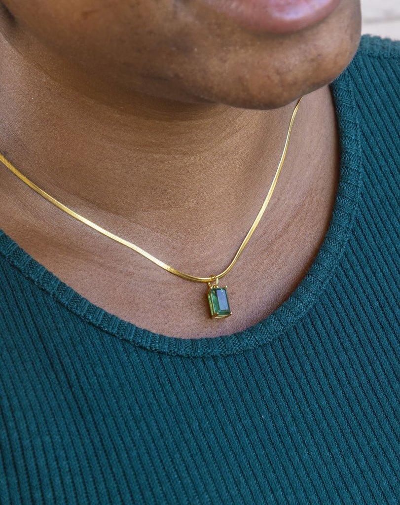 17.5" gold herringbone chain with small emerald green CZ rectangle pendant
